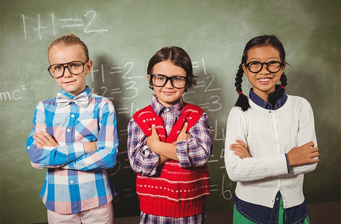 Young girl wearing glasses for myopia standing in front of a Snellen eye chart. Young girl wearing glasses for myopia standing in front of a Snellen eye chart.